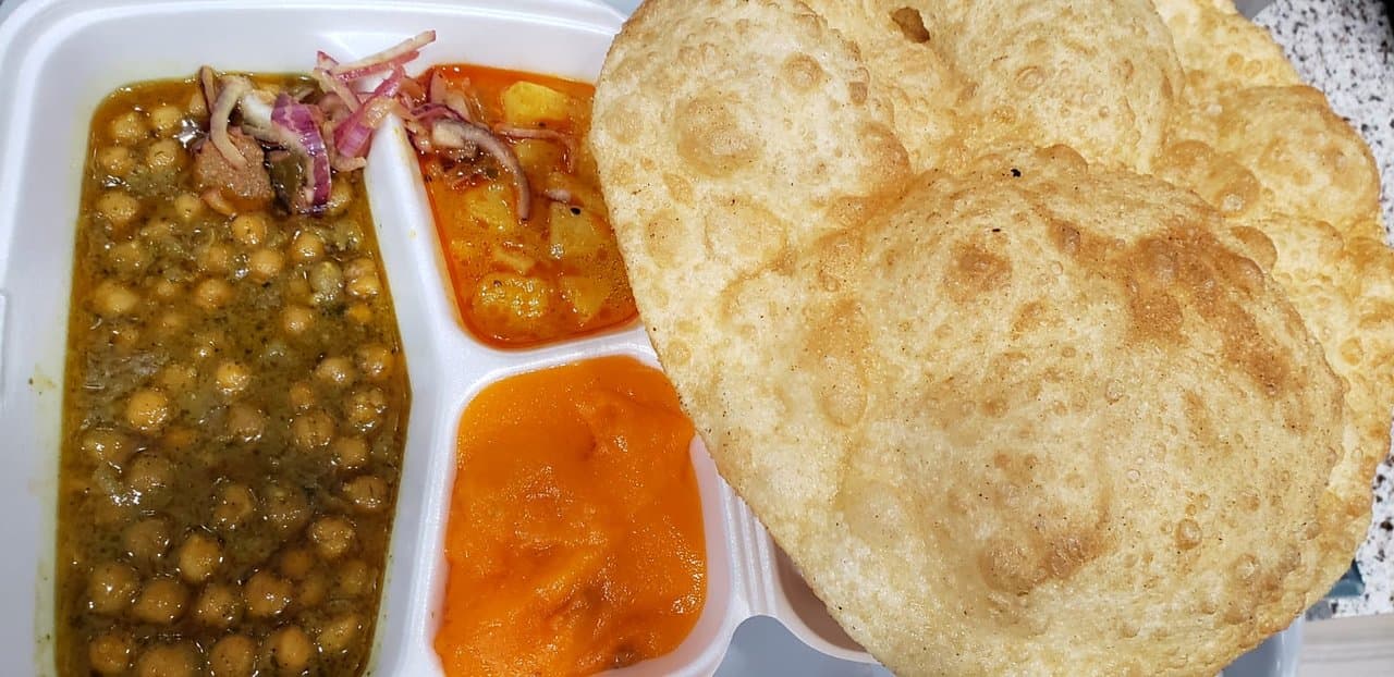 Halwa puri breakfast with Lahori chana and potato curry